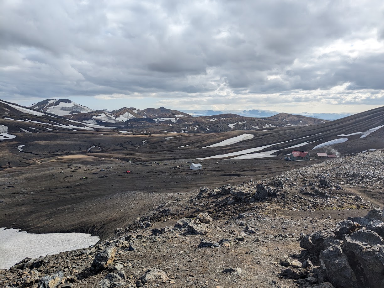 A view from a hill down towards the cabin and campgrounds at Hrafntinnusker.