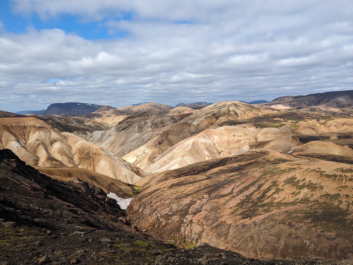 A picture of the circular walls of rock and obsidian where campers can pitch their tents inside for some cover from the inevitable wind.