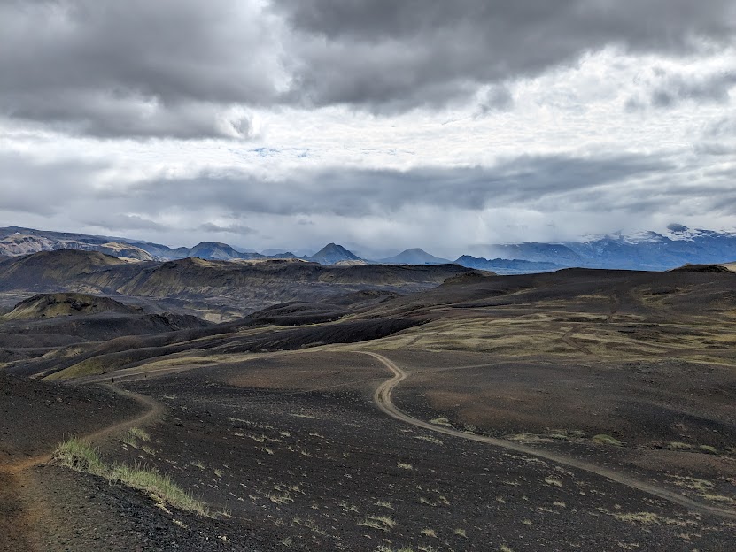 Dunes and hills, and dunes and mountains of black sand.